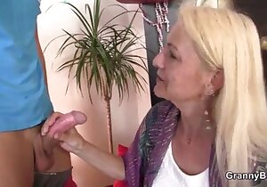 Blond-haired older lady enjoying spooning sex