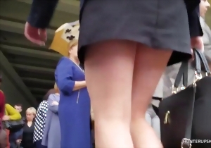 Leggy hottie in a black mini skirt shows her sweet ass